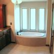 Bathroom remodel with garden bath tub and tile surround, roman bath