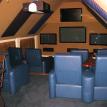 Attic after custom theater room remodel. Flat screen tvs, custom theater seating