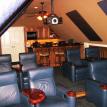 Mancave theater room with built in bar and kitchen